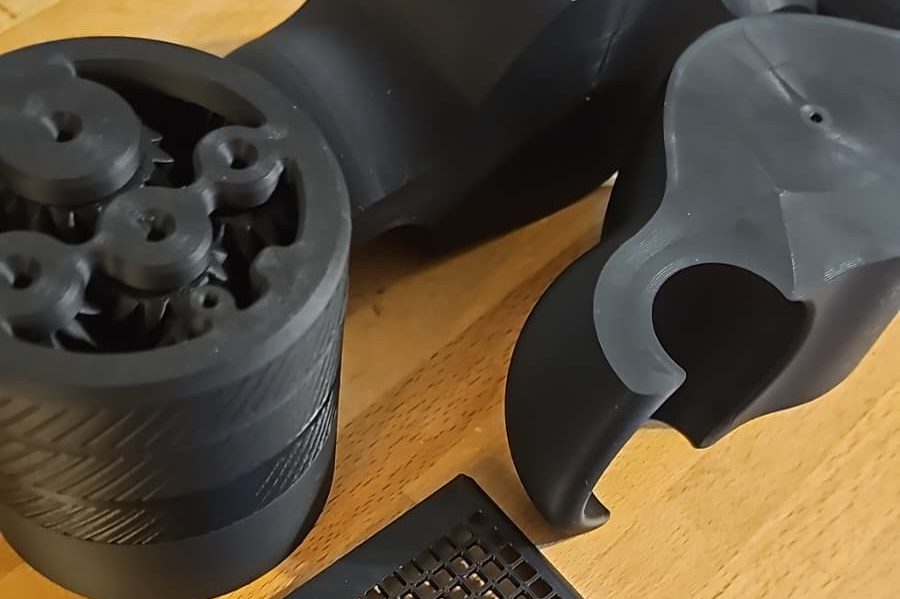 Schwarze 3D-gedruckte Teile, Abtropfsieb, Planetengetriebe, etc.